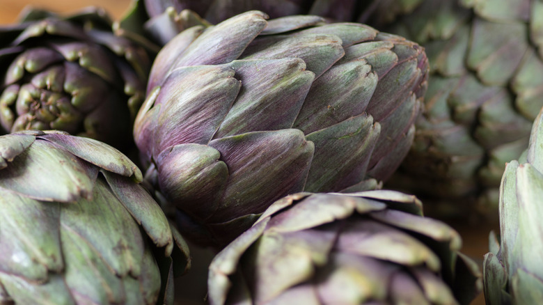 group of whole artichokes