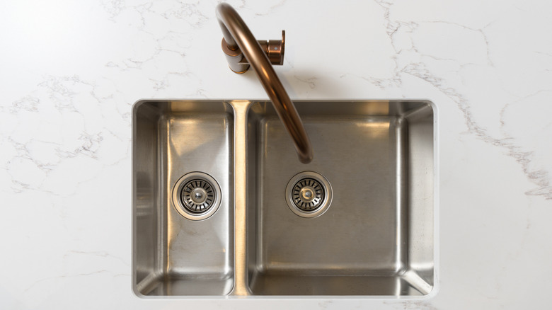 Stainless steel sink on a marble countertop