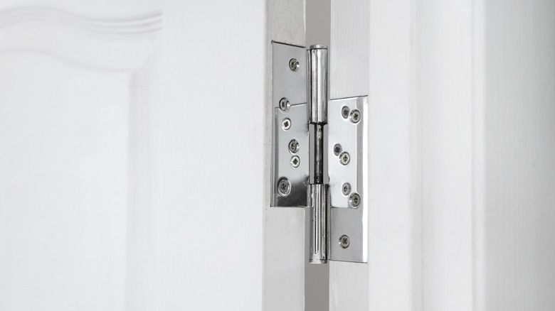 A close-up of door hinges