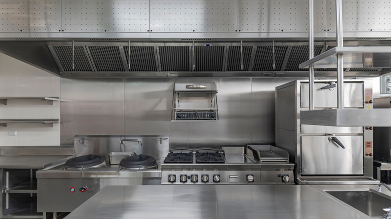 Industrial kitchen with stainless steel backsplash