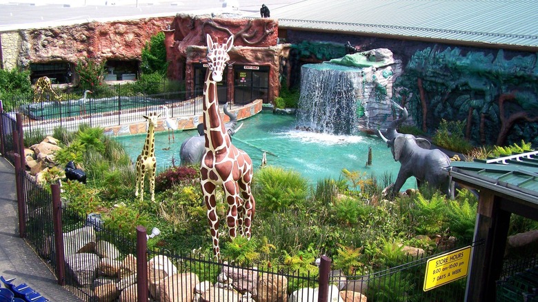 The exterior waterfall at Jungle Jim's, surrounded by animal statues