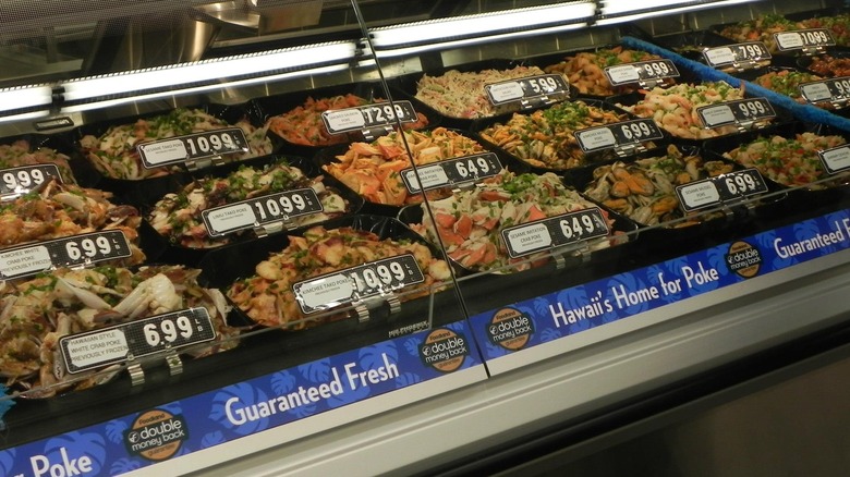 Large selection of fresh poke on display in Foodland