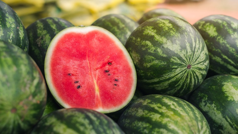 Watermelon half on watermelon pile