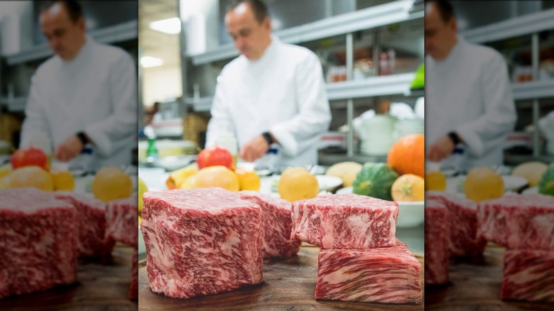 marbled steaks on cutting board