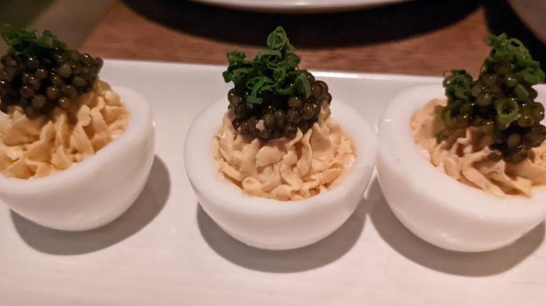 Deviled eggs topped with caviar