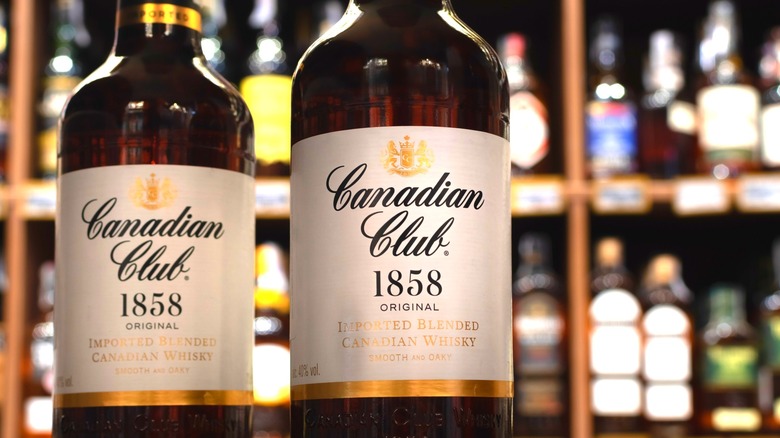 Bottles of Canadian Club 1858 whiskey in liquor shop