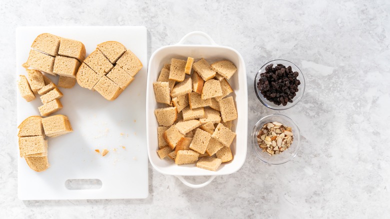 Assembling bread pudding with raisins