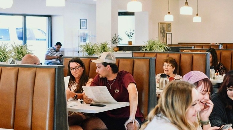 A Village Inn location interior with diners