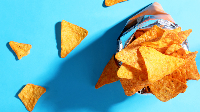Spilled Doritos on blue background