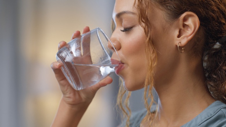 woman drinking glass of water
