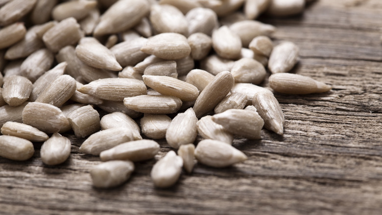 sunflower seeds on wooden surface