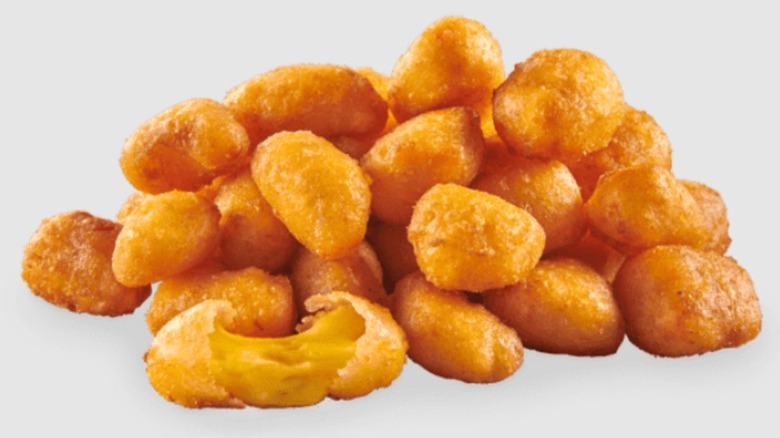 Sheetz Wisconsin Cheese Bites with one broken open to show the stretchy cheese filling