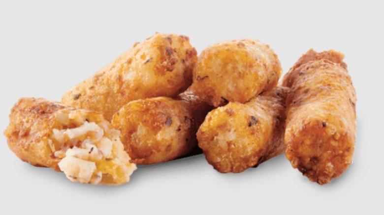 Sheetz Cheesy Tater Bombz, with one broken open to show the filling