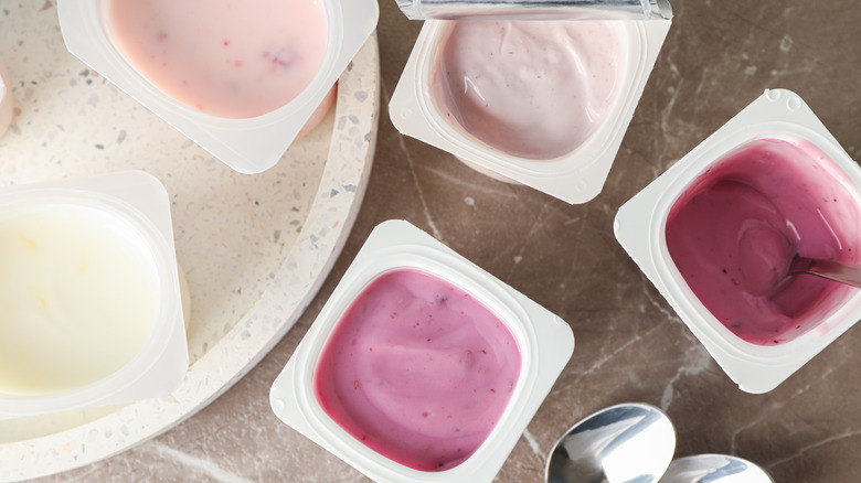 Yogurt cups on table
