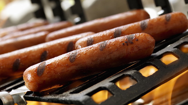 hot dogs on a grill