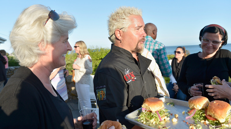 Guy Fieri handing out food