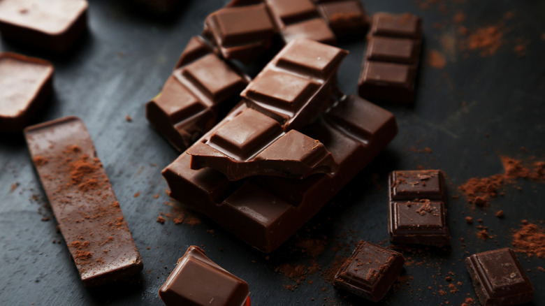 A broken bar of chocolate on a table