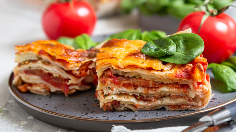 Two pieces of lasagna on plate