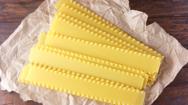 Wavy lasagna noodles on paper
