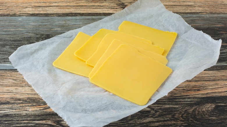 A few slices of American cheese laid on wax paper