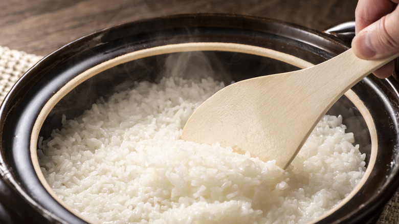 Stirring rice in pot