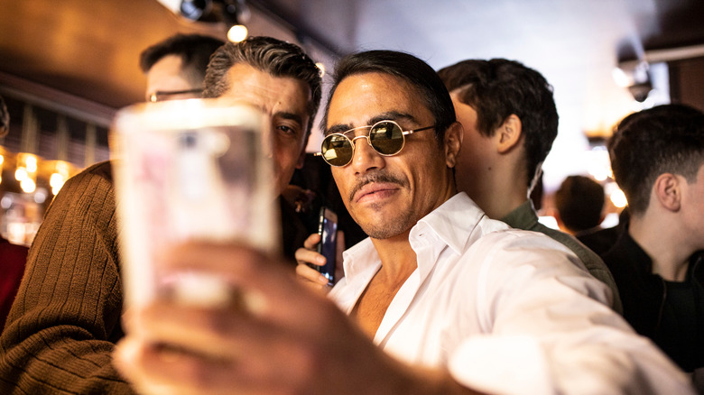 Salt Bae taking a selfie 