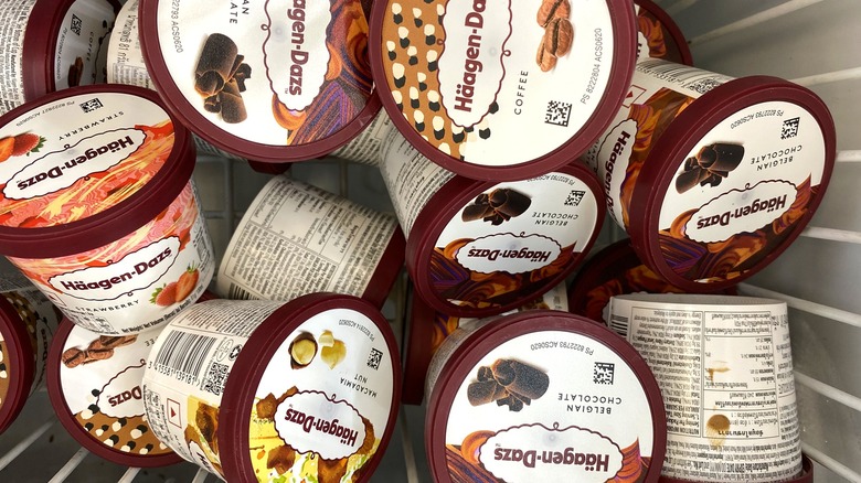 some Häagen-Dazs containers piled up in a freezer