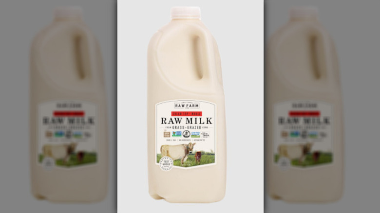 Half gallon of Raw Farm raw milk on a white background