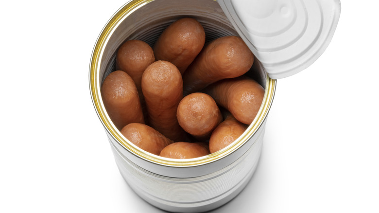 overhead shot of opened can of hot dogs