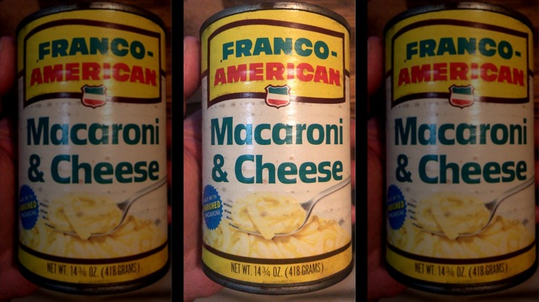yellow can of Franco-American Macaroni with cheese sauce on white background