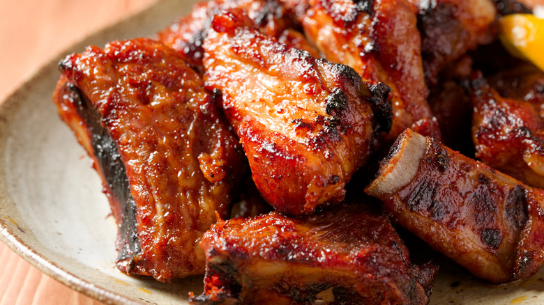 close-up of sauced spareribs on a plate