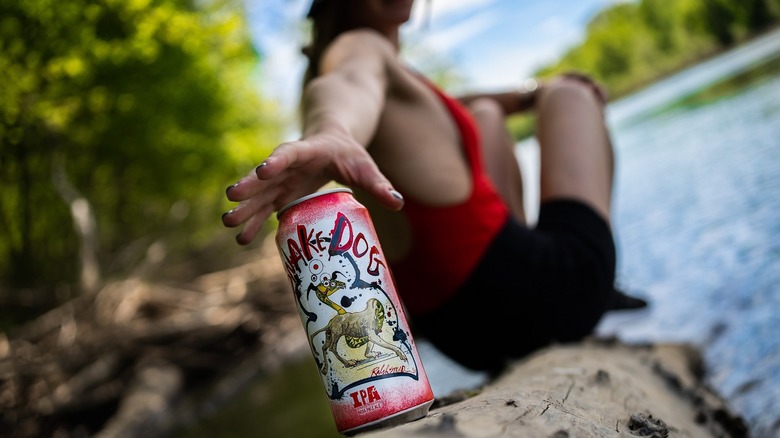 Person reaching for IPA beer