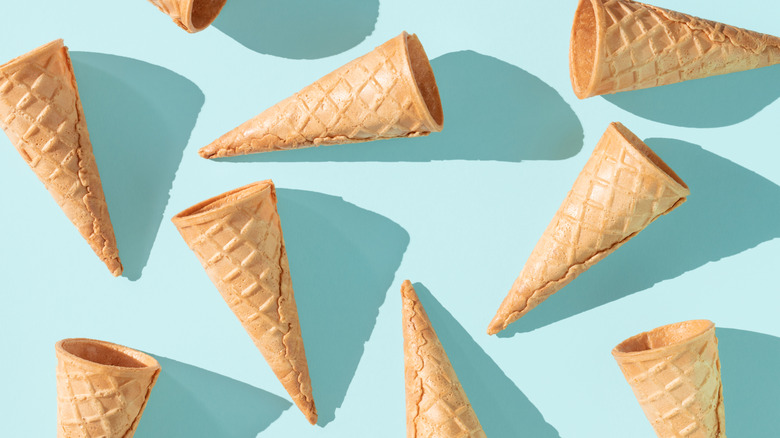 Empty ice cream waffle cones on a light blue background