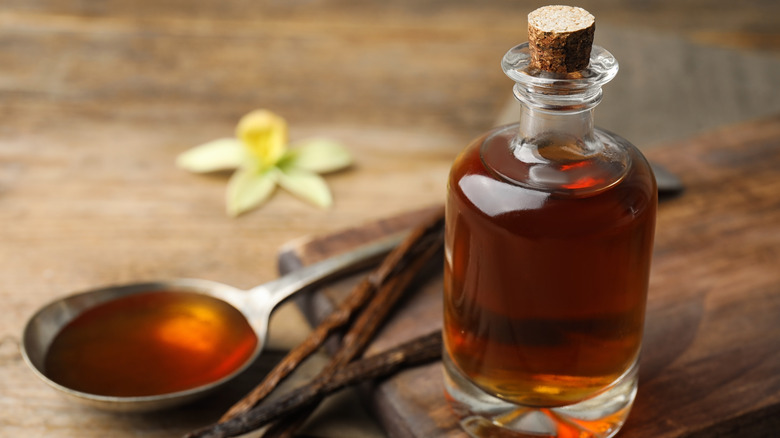 vanilla extract in bottle and spoon