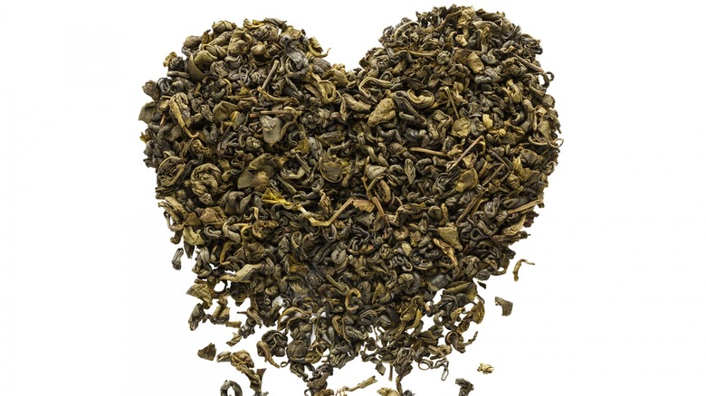 Heart-shaped tea leaves falling