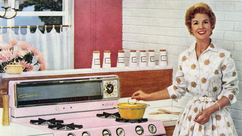 Illustration of a 1950s housewife smiling while standing over a stove