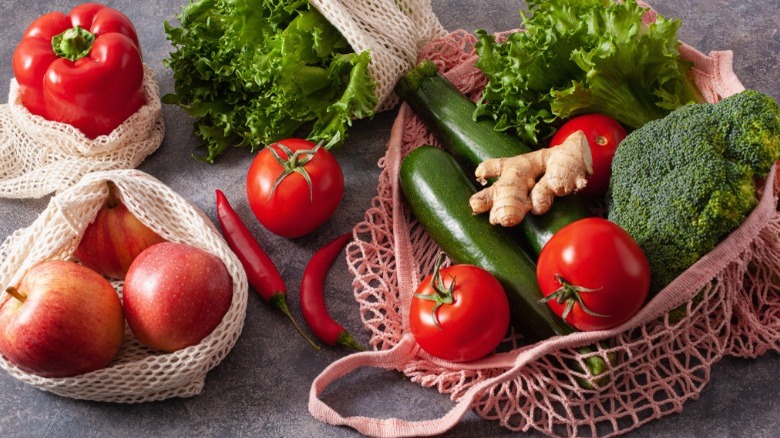 vegetables and fruit in mesh shopping bags
