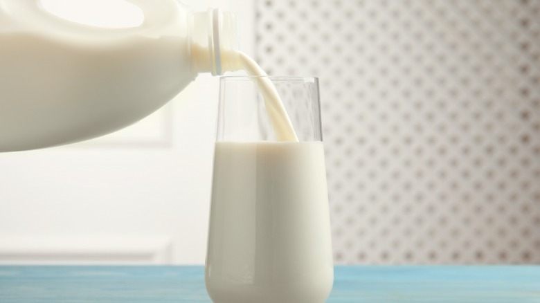 milk being poured into glass
