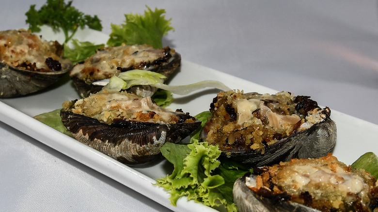 Clams casino plated with lettuce