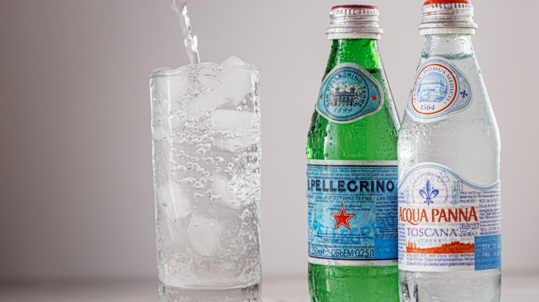 Bottled Italian water and water poured into glass