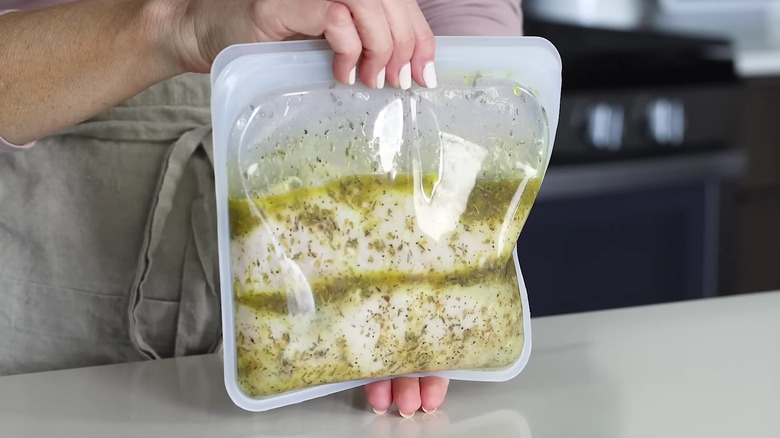 Chicken marinating in bag