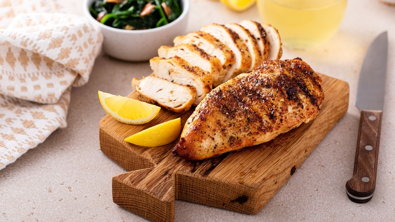 Cooked chicken breast on board