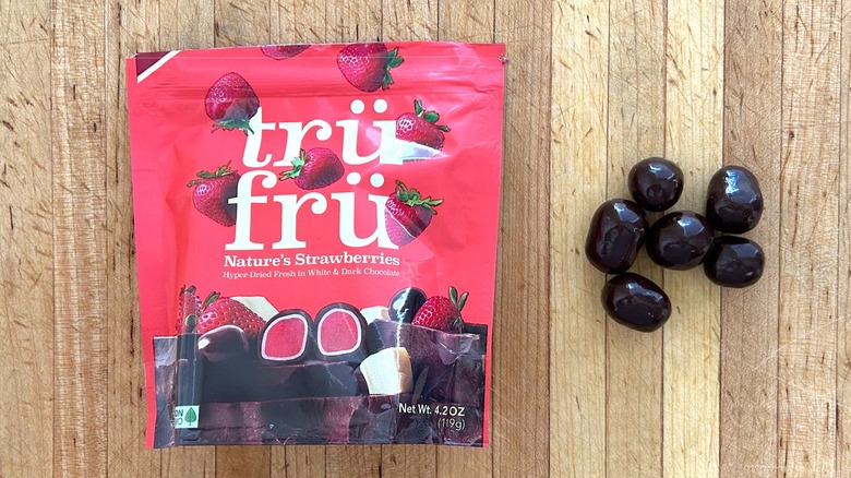 Package and pieces of Nature's Strawberries Hyper-Dried in White and Dark Chocolate