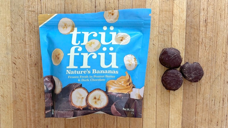 Package and pieces of Nature's Bananas Hyper-Chilled in Dark Chocolate and Peanut Butter