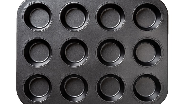 Muffin tin on white background