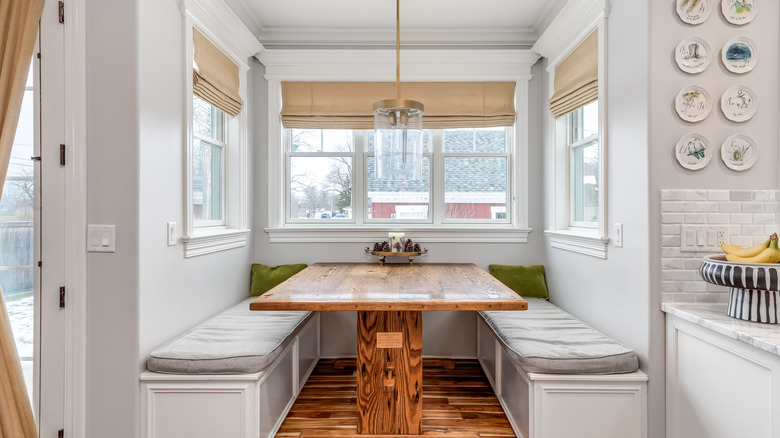 A kitchen breakfast booth with a table and benches