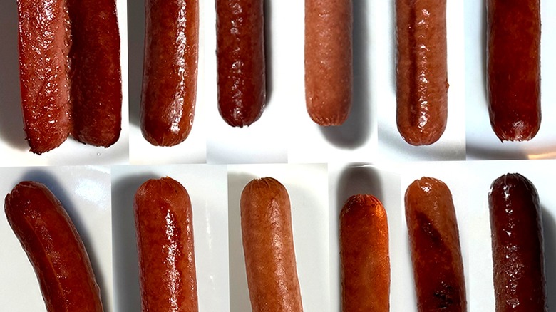 Close-up of various cooked hot dogs, showing their different textures.