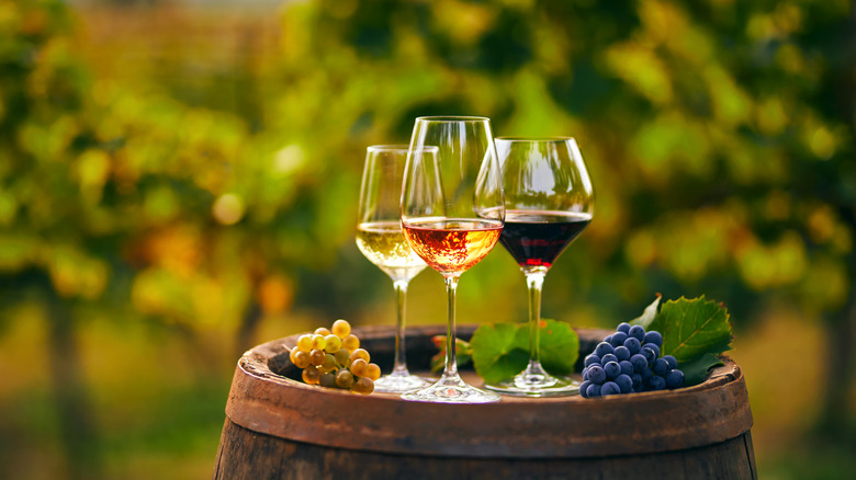 glasses of wine on barrel 