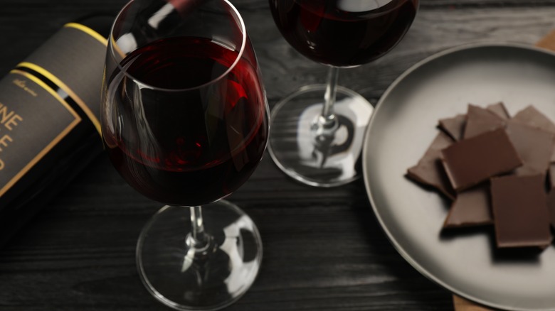 Glass of wine near chocolate