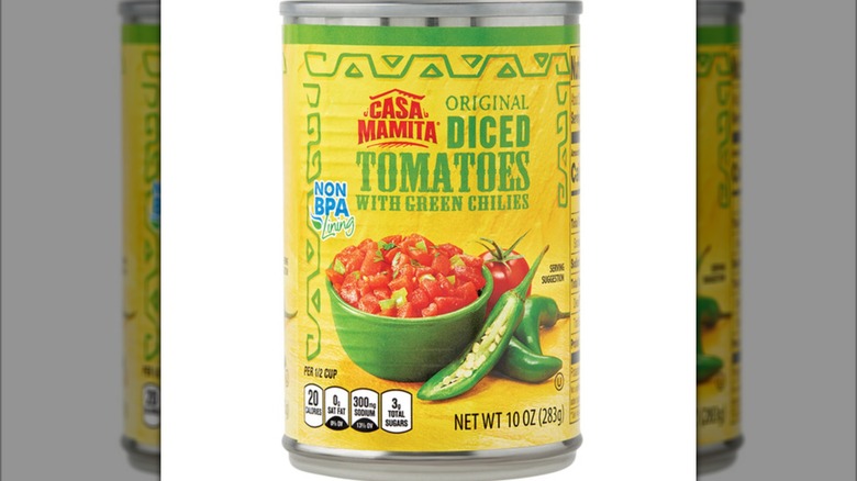 a front view of a can of Casa Mamita Diced Tomatoes With Green Chiles against a white background.